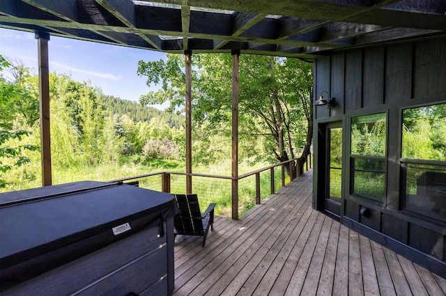 210 3rd St, Dover, ID 83825 - wooden terrace with a forest view, a hot tub, and area for grilling