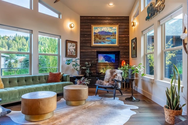 210 3rd St, Dover, ID 83825 - living room with plenty of natural light, rustic walls, wood finished floors, a high ceiling, and recessed lighting