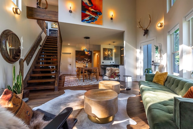 210 3rd St, Dover, ID 83825 - living room featuring a towering ceiling, wood finished floors, and stairs