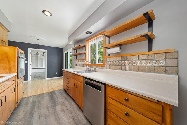 11918 E Grace Ave, Spokane Valley, WA 99206 - kitchen with appliances with stainless steel finishes, open shelves, wood finished floors, light countertops, and backsplash