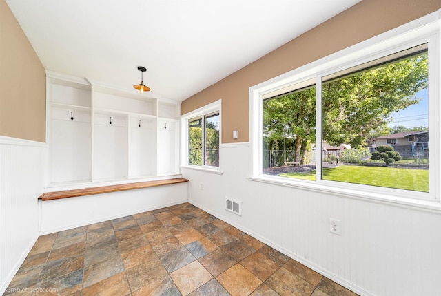 11918 E Grace Ave, Spokane Valley, WA 99206 - mudroom featuring dark stone finish flooring and wainscoting