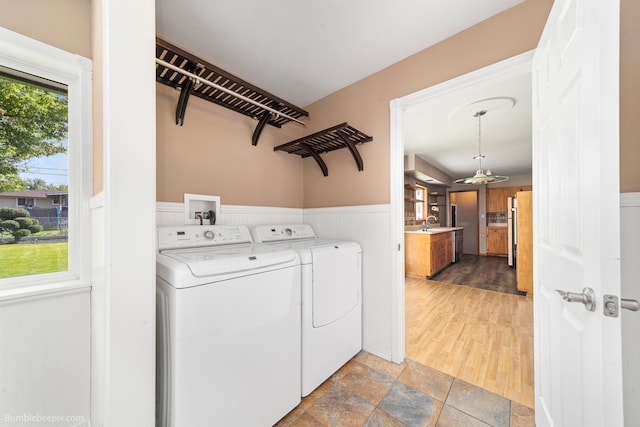 11918 E Grace Ave, Spokane Valley, WA 99206 - washroom featuring wainscoting, washer and clothes dryer, and stone finish flooring