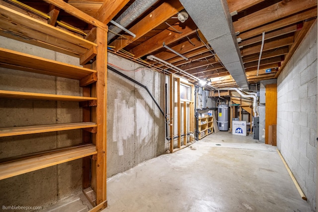 11918 E Grace Ave, Spokane Valley, WA 99206 - unfinished basement featuring electric water heater and heating unit