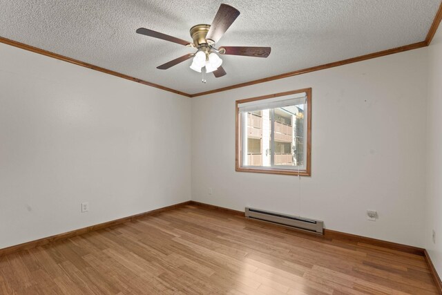 214 W 6th Ave Apt 201, Spokane, WA 99204 - spare room featuring a baseboard radiator, light wood-style floors, a textured ceiling, a ceiling fan, and crown molding