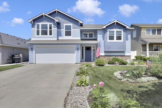 1707 E Vanetta Ave, Spokane, WA 99217 - view of front of property featuring a garage, concrete driveway, and a front lawn