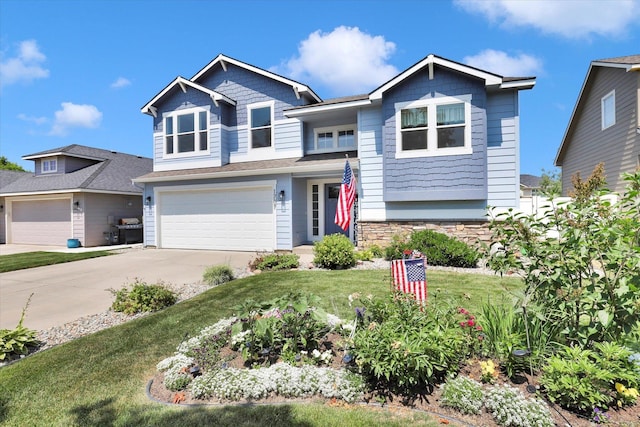 1707 E Vanetta Ave, Spokane, WA 99217 - view of front of home with concrete driveway, a garage, a front lawn, and stone siding