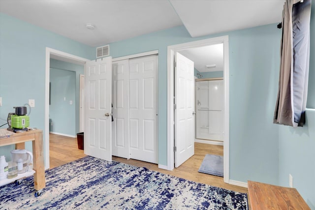 1707 E Vanetta Ave, Spokane, WA 99217 - bedroom with wood finished floors, a closet, and connected bathroom