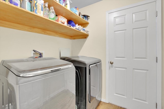 1707 E Vanetta Ave, Spokane, WA 99217 - washroom with washing machine and clothes dryer and light wood finished floors