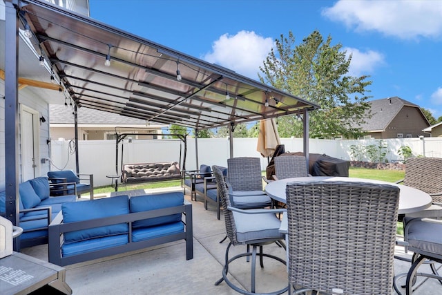 1707 E Vanetta Ave, Spokane, WA 99217 - fenced backyard with an outdoor hangout area, outdoor dining space, and a patio