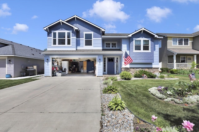 1707 E Vanetta Ave, Spokane, WA 99217 - view of front of property with an attached garage, concrete driveway, and a front yard
