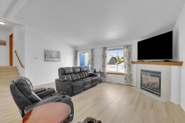 1707 E Vanetta Ave, Spokane, WA 99217 - living room with a fireplace, wood finished floors, and stairs