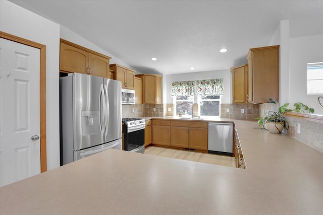 1707 E Vanetta Ave, Spokane, WA 99217 - kitchen with appliances with stainless steel finishes, plenty of natural light, decorative backsplash, light countertops, and recessed lighting
