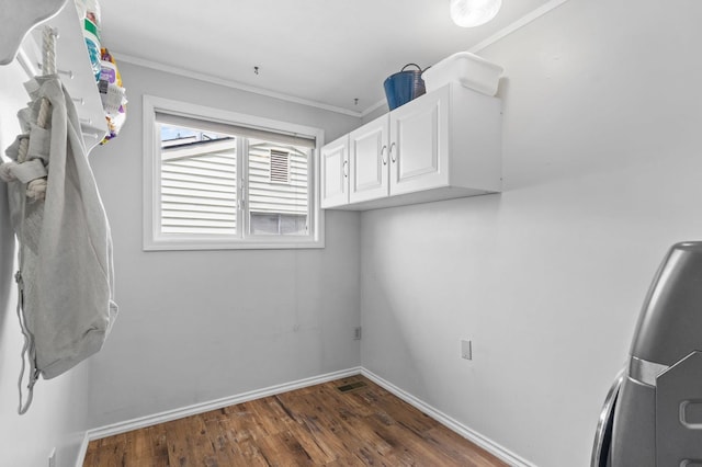 6204 N Oxford Dr, Spokane, WA 99208 - laundry room featuring wood finished floors, crown molding, and cabinet space