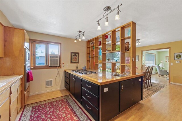 3157 E 35th Ave, Spokane, WA 99223 - kitchen with appliances with stainless steel finishes, light countertops, healthy amount of natural light, and open shelves