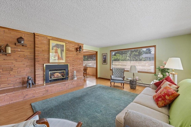 3157 E 35th Ave, Spokane, WA 99223 - living area with a fireplace, a textured ceiling, and wood finished floors