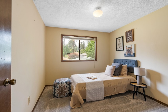 10818 N Humboldt Dr, Spokane, WA 99218 - carpeted bedroom with baseboards and a textured ceiling