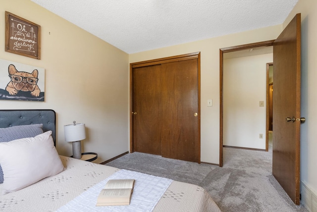 10818 N Humboldt Dr, Spokane, WA 99218 - bedroom with carpet flooring, a closet, and a textured ceiling