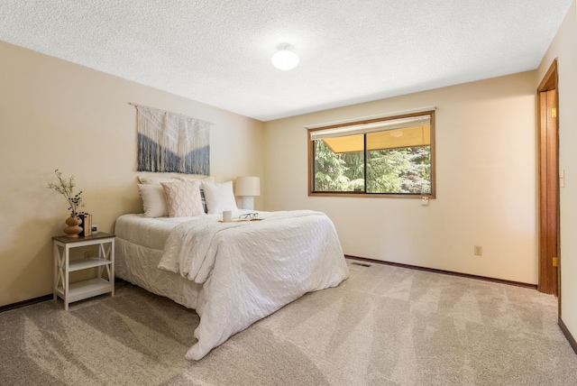 10818 N Humboldt Dr, Spokane, WA 99218 - carpeted bedroom featuring a textured ceiling and baseboards