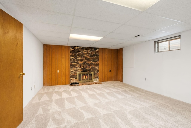 10818 N Humboldt Dr, Spokane, WA 99218 - below grade area with carpet flooring, a fireplace, a drop ceiling, and wood walls