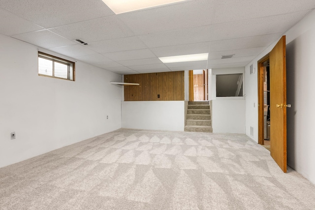 10818 N Humboldt Dr, Spokane, WA 99218 - below grade area featuring carpet floors, a drop ceiling, and stairway