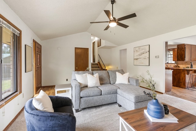 10818 N Humboldt Dr, Spokane, WA 99218 - living room featuring ceiling fan, lofted ceiling, and stairway