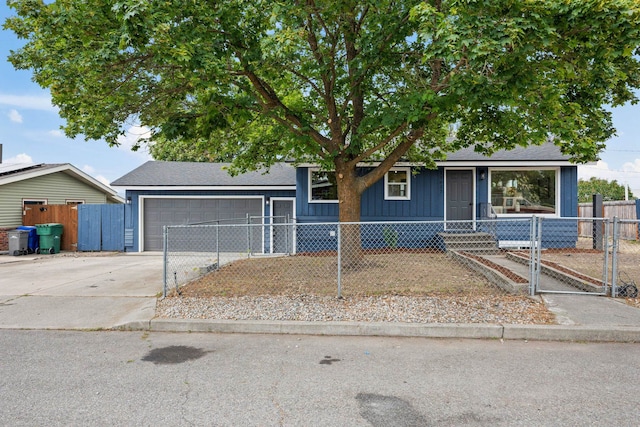 11617 E Augusta Ave, Spokane Valley, WA 99206 - view of front of property featuring an attached garage, concrete driveway, a fenced front yard, and a gate