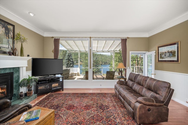 2008 S Zephyr Rd, Liberty Lake, WA 99019 - living area with wood finished floors, crown molding, a high end fireplace, and wainscoting
