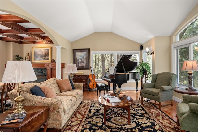 2008 S Zephyr Rd, Liberty Lake, WA 99019 - living room featuring ornate columns, wood finished floors, arched walkways, and vaulted ceiling