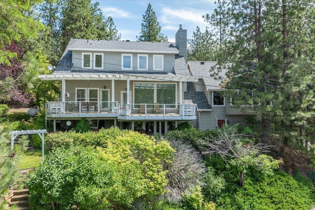 2008 S Zephyr Rd, Liberty Lake, WA 99019 - rear view of house with a deck and a chimney
