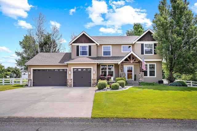 2813 S Steen Ln, Greenacres, WA 99016 - craftsman-style house featuring a garage, concrete driveway, a shingled roof, and stone siding