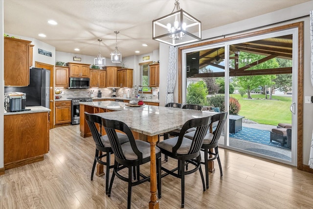 2813 S Steen Ln, Greenacres, WA 99016 - dining area with light wood-style floors, a chandelier, and recessed lighting