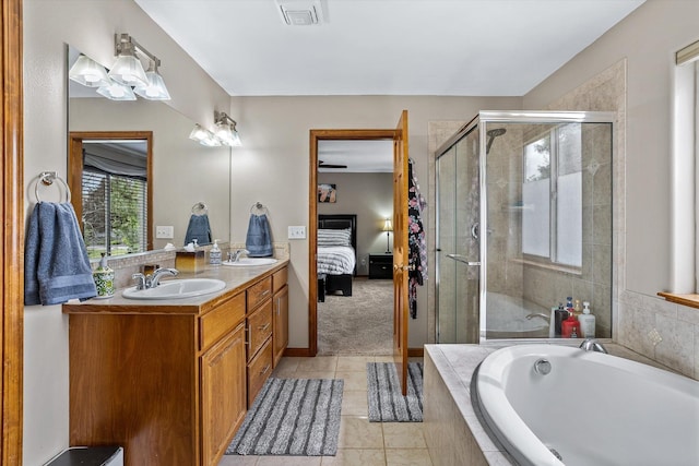 2813 S Steen Ln, Greenacres, WA 99016 - ensuite bathroom featuring a bath, double vanity, a shower stall, and tile patterned floors