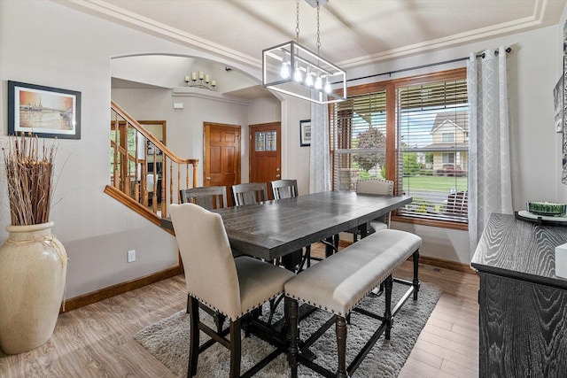 2813 S Steen Ln, Greenacres, WA 99016 - dining area featuring a chandelier, light wood-style floors, arched walkways, and stairs