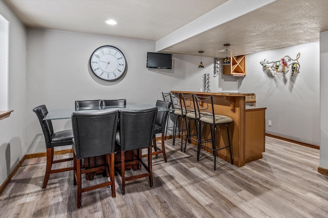2813 S Steen Ln, Greenacres, WA 99016 - dining space with a bar, light wood-style floors, and recessed lighting