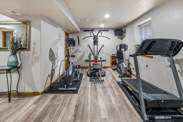 2813 S Steen Ln, Greenacres, WA 99016 - exercise room with wood finished floors, a textured ceiling, and recessed lighting