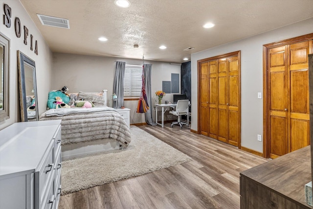 2813 S Steen Ln, Greenacres, WA 99016 - bedroom featuring a desk, recessed lighting, light wood-style floors, and a textured ceiling