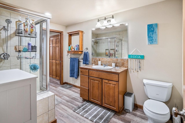 2813 S Steen Ln, Greenacres, WA 99016 - bathroom with vanity, a shower stall, and wood finished floors