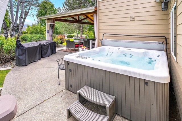 2813 S Steen Ln, Greenacres, WA 99016 - view of patio / terrace featuring a hot tub, outdoor dining area, and grilling area