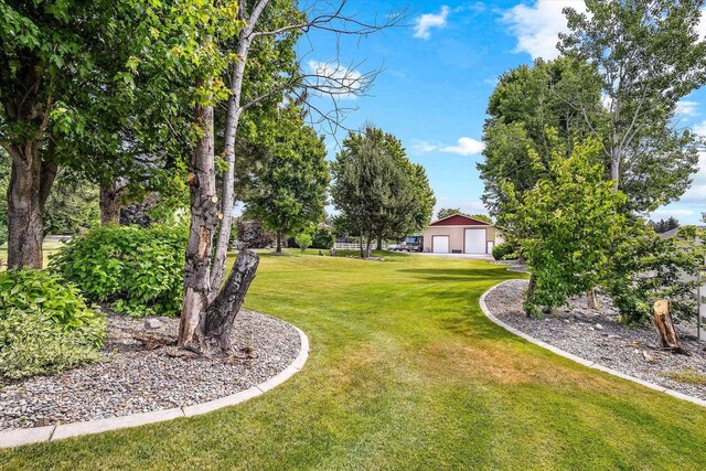 2813 S Steen Ln, Greenacres, WA 99016 - view of grassy yard featuring a garage