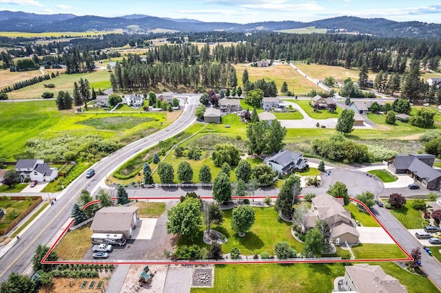 2813 S Steen Ln, Greenacres, WA 99016 - aerial view of property's location with property boundaries highlighted and a mountainous background