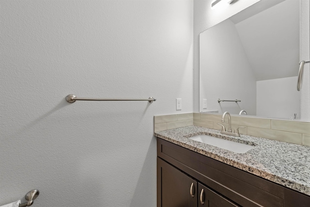 419 E E St, Deer Park, WA 99006 - bathroom featuring vanity and backsplash