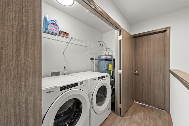 419 E E St, Deer Park, WA 99006 - laundry area featuring electric water heater, separate washer and dryer, and light wood finished floors