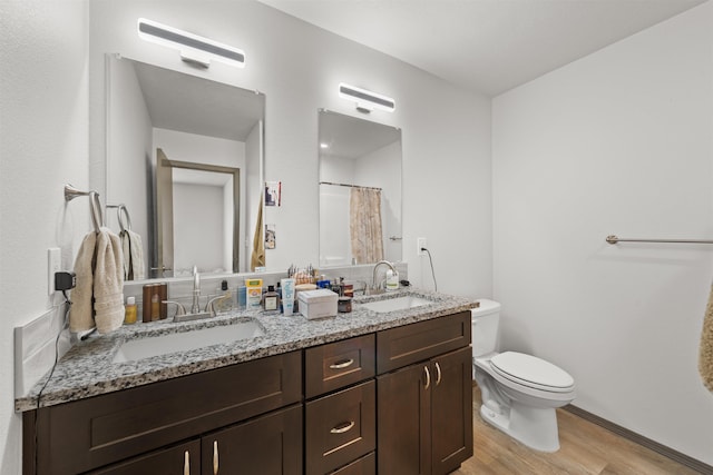 419 E E St, Deer Park, WA 99006 - bathroom featuring wood finished floors and double vanity