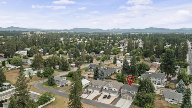 419 E E St, Deer Park, WA 99006 - aerial overview of property's location with a mountain backdrop and nearby suburban area
