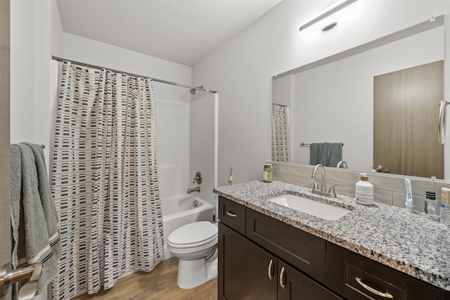 419 E E St, Deer Park, WA 99006 - bathroom featuring wood finished floors, vanity, and shower / bath combo