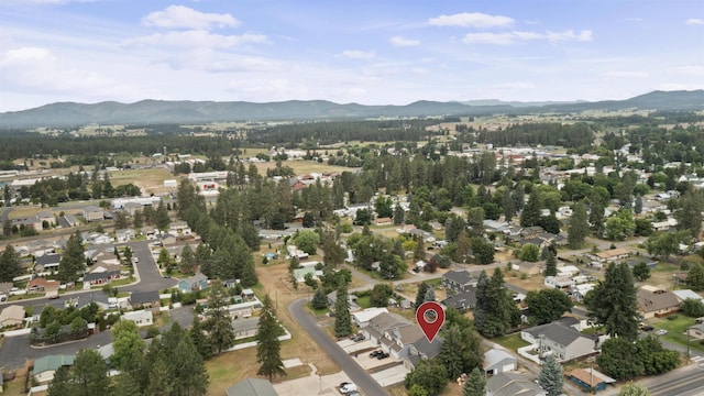 419 E E St, Deer Park, WA 99006 - aerial view of property's location featuring a mountainous background and nearby suburban area