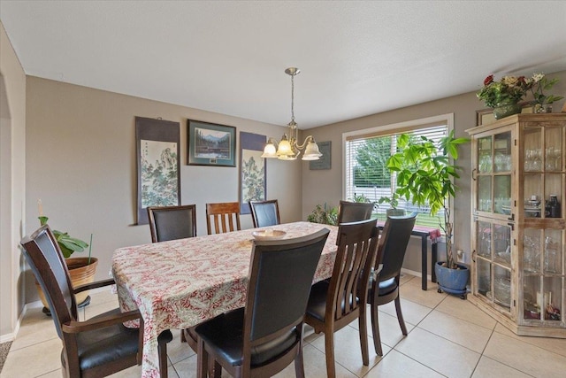 9713 W Sage Ct, Cheney, WA 99004 - dining area with a chandelier and light tile patterned flooring