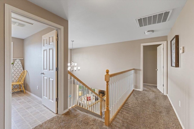 9713 W Sage Ct, Cheney, WA 99004 - hallway featuring an upstairs landing, a chandelier, and light colored carpet