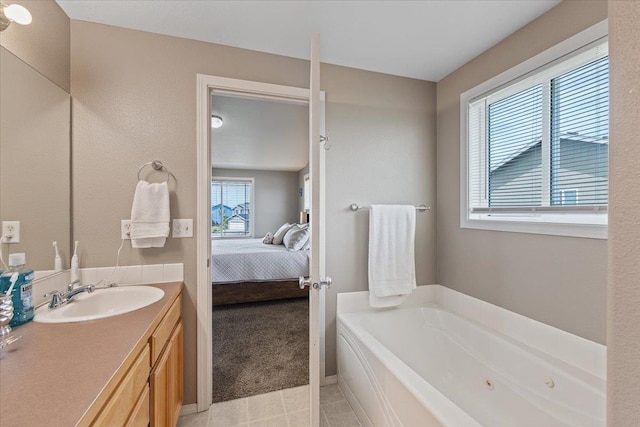 9713 W Sage Ct, Cheney, WA 99004 - ensuite bathroom with a whirlpool tub, tile patterned floors, and vanity