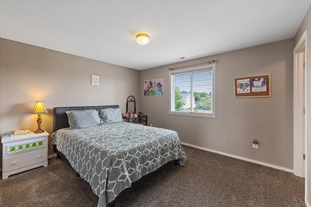 9713 W Sage Ct, Cheney, WA 99004 - bedroom with dark colored carpet and baseboards
